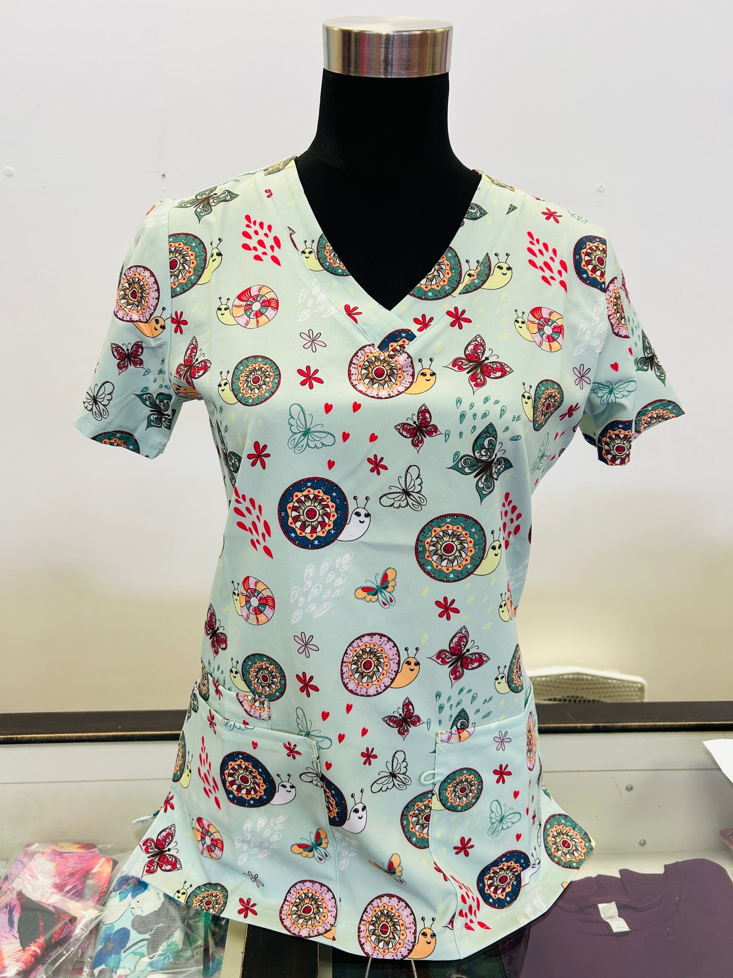 1881SGE Sage Green Colourful Snails & Butterflies Printed Women's Scrub Top