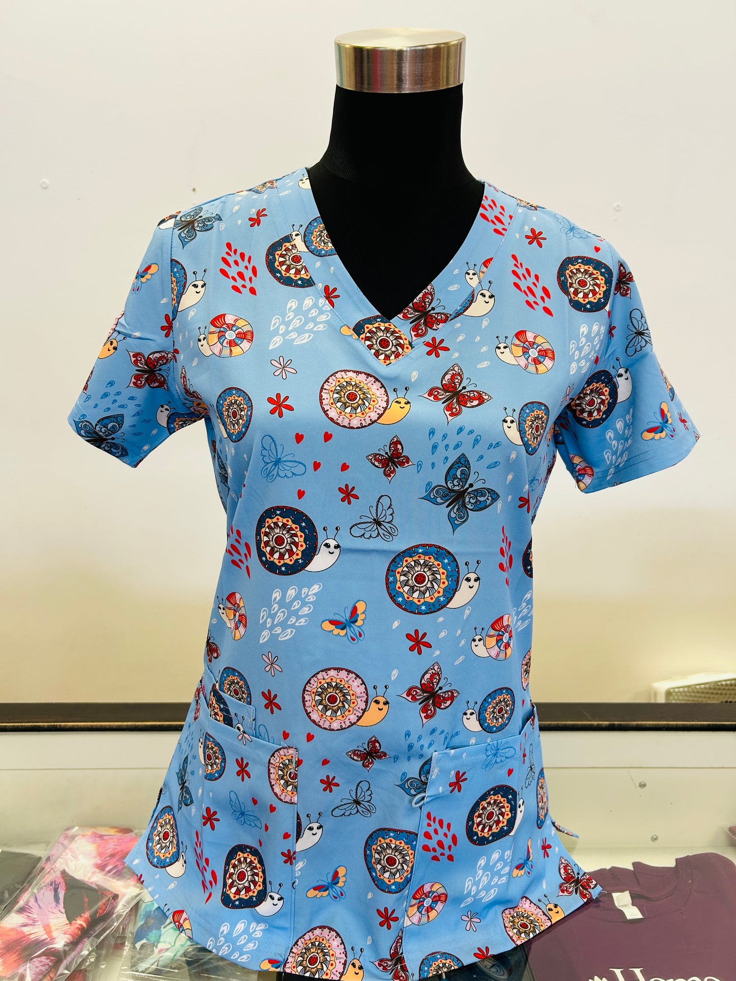 1881BL Colourful Snails and Butterflies Ceil Blue Printed Women's Scrub Top